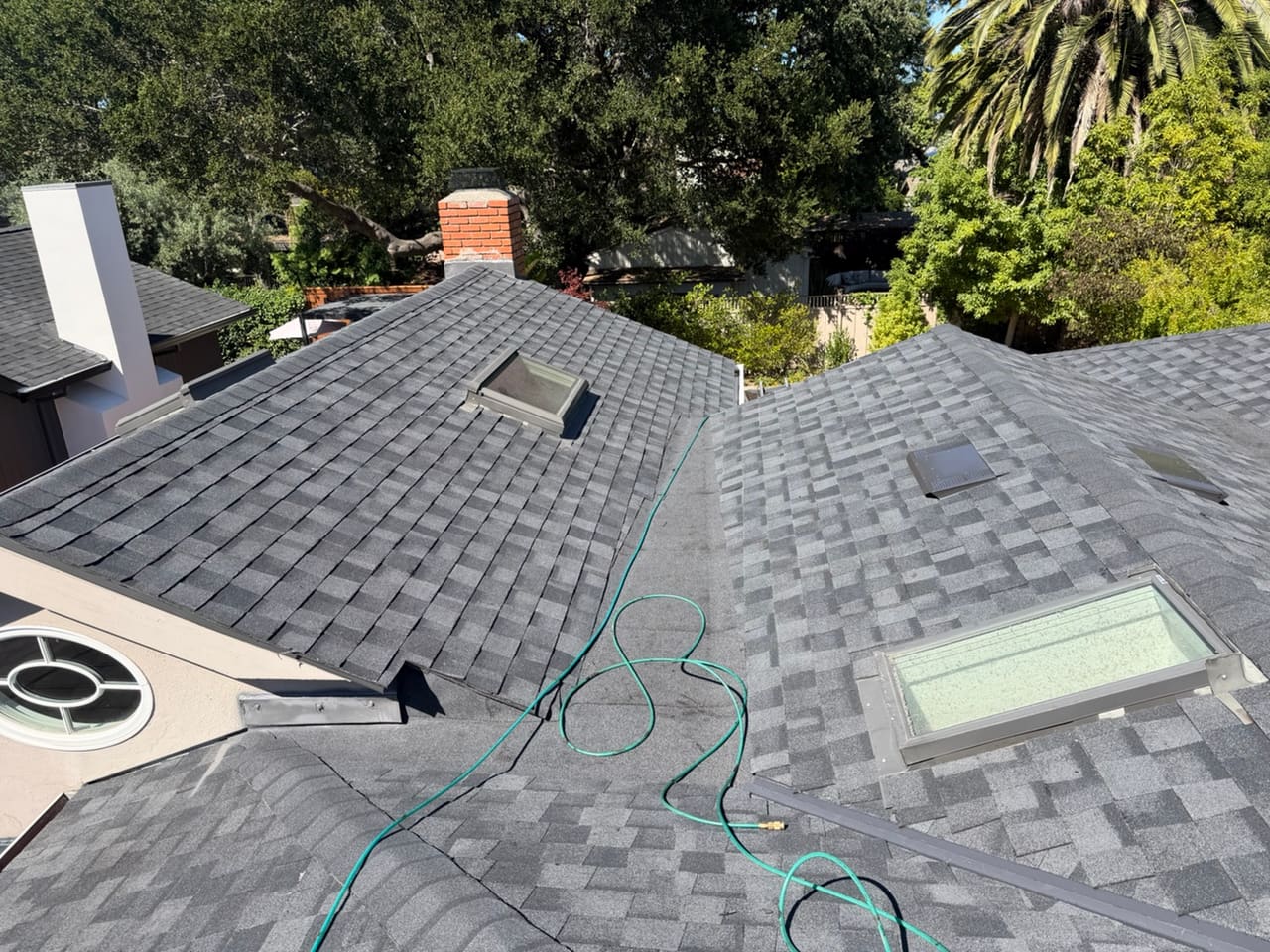 Completed gray asphalt shingle roof in San Carlos