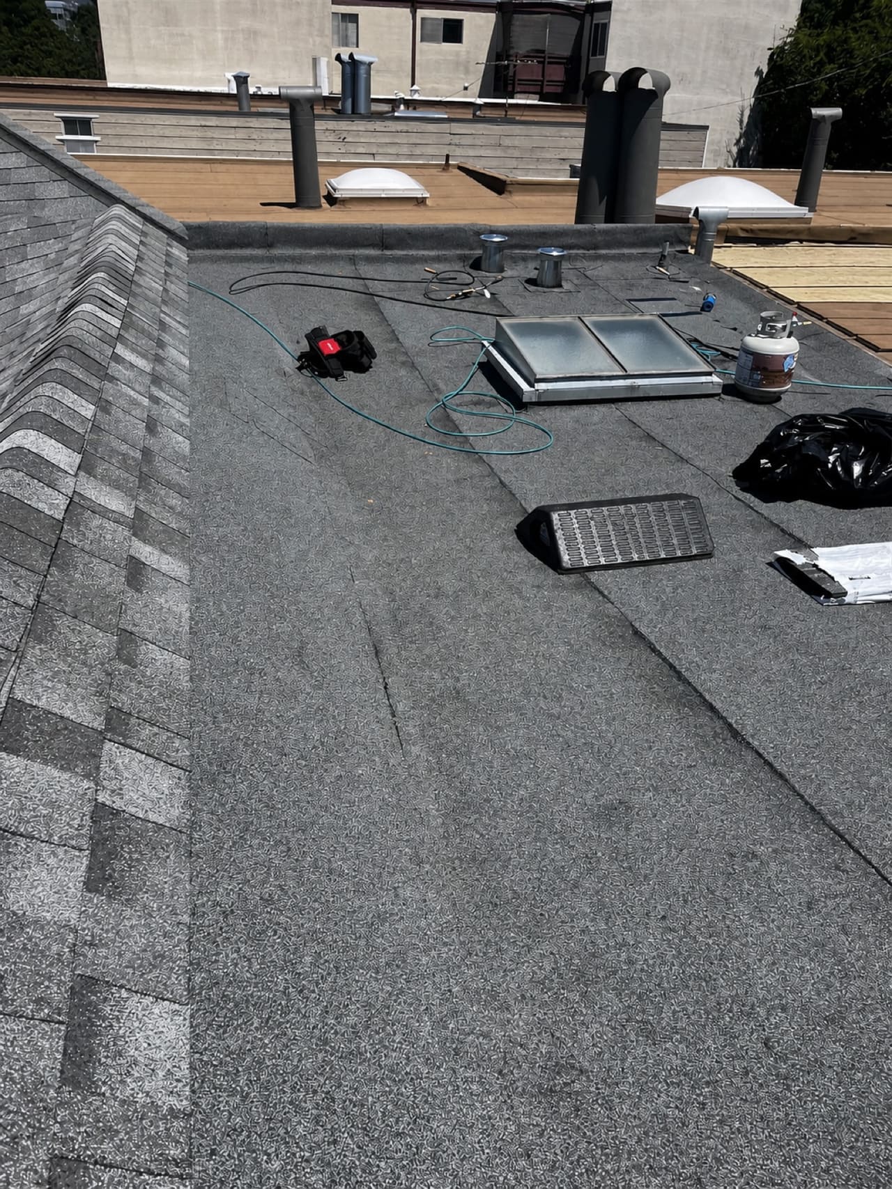 Low-slope membrane work around skylights and vents