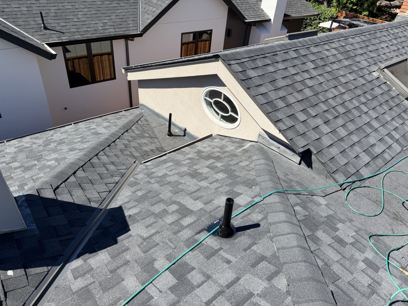 Completed shingles at intersecting roof planes in San Carlos