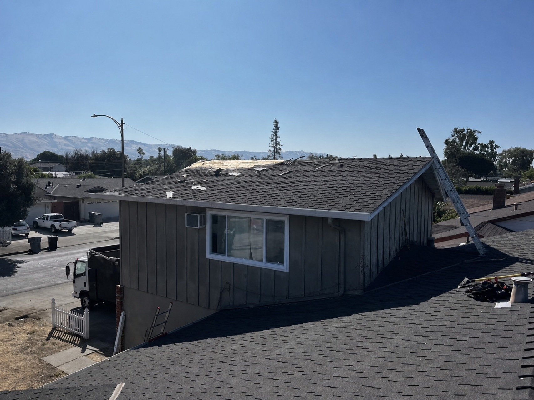Asphalt shingles being replaced on a San Jose home