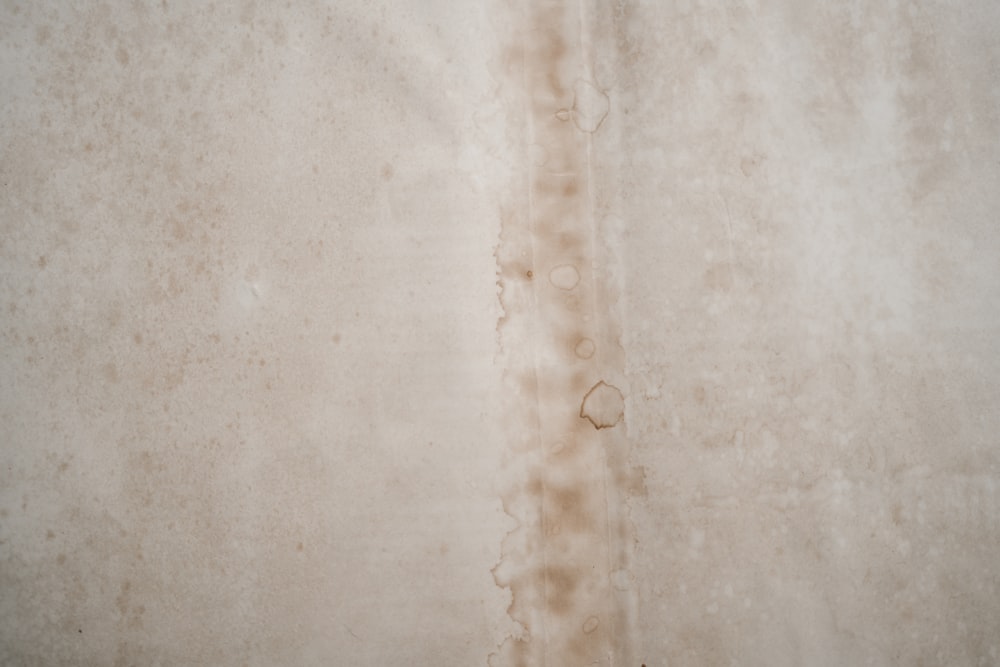 Brown water stain along a ceiling seam